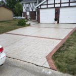 two tone patterned concrete driveway sealed